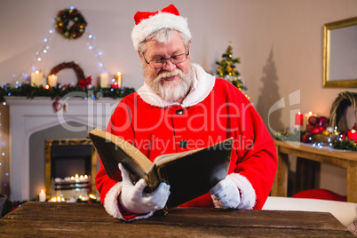 Santa Claus reading book