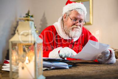 Santa Claus reading a letter