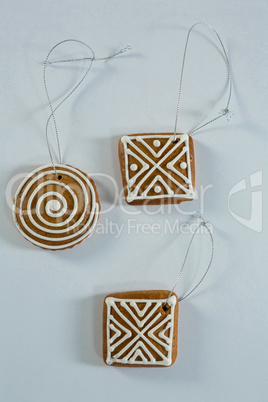 Overhead view of gingerbread cookie with strings