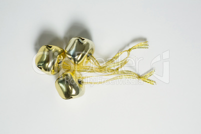 Overhead view of jingle bells with ribbon