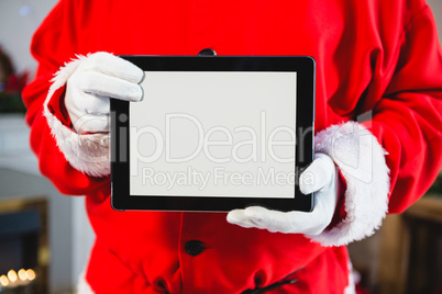 Santa claus holding a digital tablet