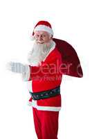 Santa Claus holding christmas bag