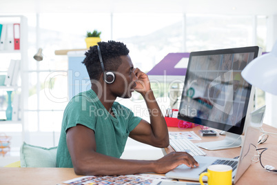 Executive working on laptop in office