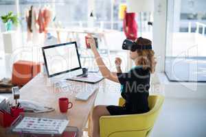 Female designer using virtual reality headset