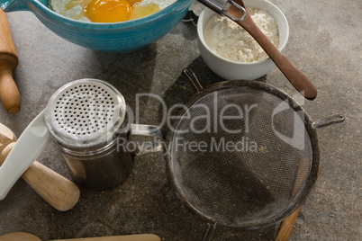 Gingerbread cookies ingredients with various utensils on table