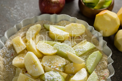 Slice of apple on tart with icing sugar