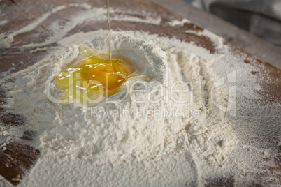 Liquid egg poured on flour