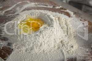 Liquid egg poured on flour