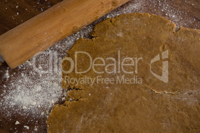 Flattened dough on a wooden table