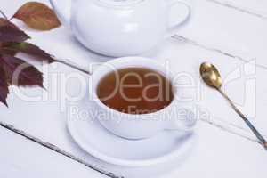 tea in a white round cup and saucer