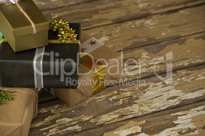 Various wrapped gift box on wooden table
