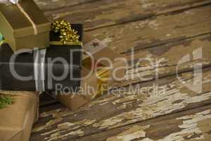 Various wrapped gift box on wooden table