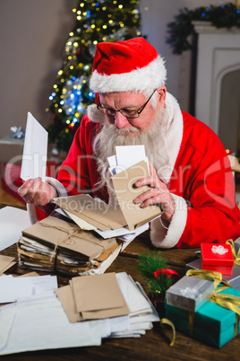 Santa Claus removing a letter