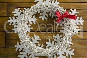 Close up of wreath decoration on artificial snow flake