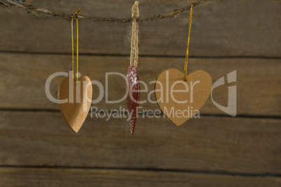 Close up of heart shape decoration hanging on rope