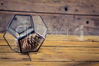 Pine cone in glass container