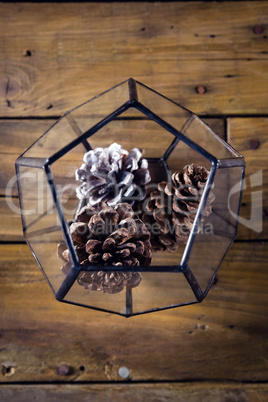 Pine cone in glass container