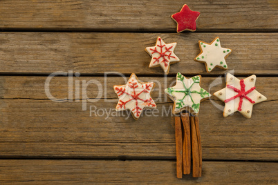 Overhead view of Christmas tree made with star shape cookies and cinnamon sticks