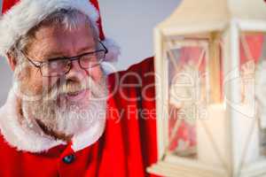Santa Claus holding Christmas lantern
