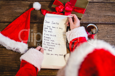 Santa Claus reading scroll