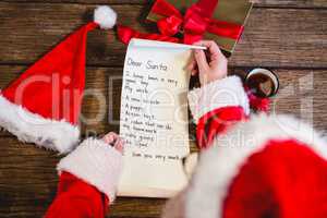 Santa Claus reading scroll