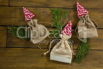 Overhead view of mint candies in jute sack with twigs