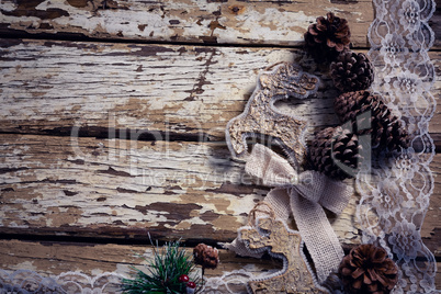 Christmas decoration and lace on wooden plank