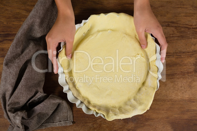 Woman preparing fruit tart