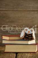 Book stack and christmas decoration on wooden plank