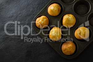 Plain cupcakes on baking tray