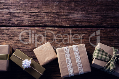 Various gift boxes on wooden plank