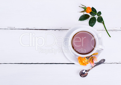 round white cup and saucer inside hot black tea