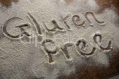 The word gluten free written on sprinkled flour