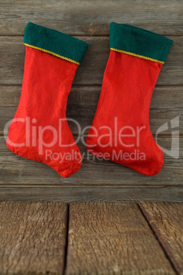 Christmas stocking hanging on wooden background