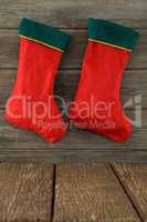 Christmas stocking hanging on wooden background