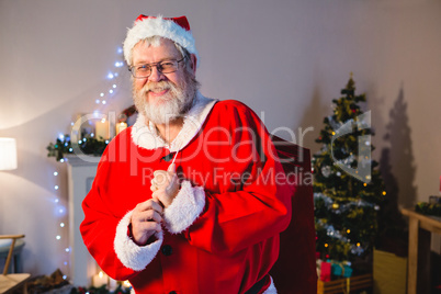 Santa Claus holding christmas bag