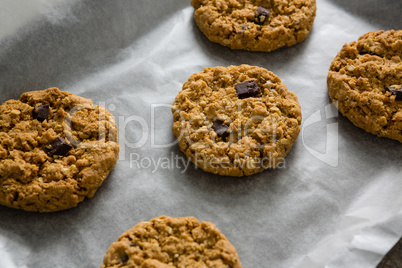 Freshly baked cookies on wax paper