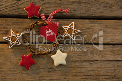 Overhead view of gingerbread cookies with Christmas decoration on table