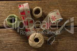 Overhead view of thread and jute spools with scissor
