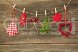 Christmas decorations hanging against wooden wall
