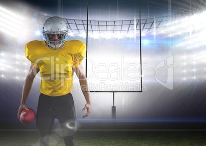 american football  player standing in front of the goal