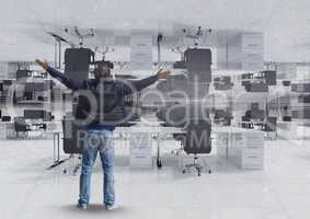 Man standing and spreading arms in inverted office
