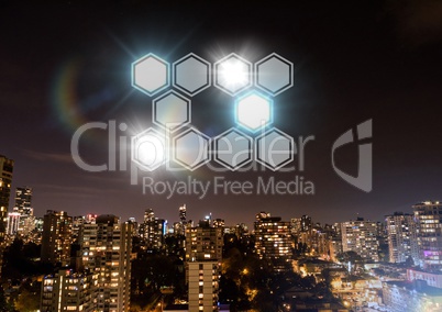 Icons interface of hexagons glowing over night city background