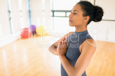 Woman performing yoga in the gym