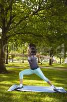 Woman performing stretching exercise in the park