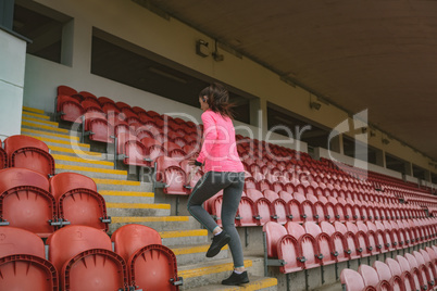 Woman jogging in stadium