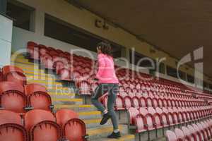 Woman jogging in stadium