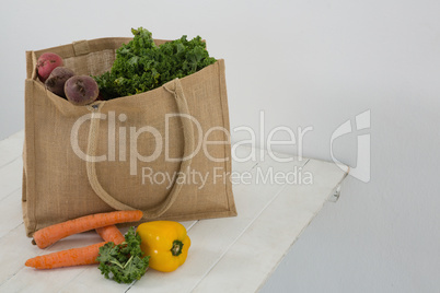 Fresh vegetables in grocery bag