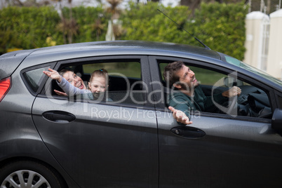 Father, mother and daughter in the car