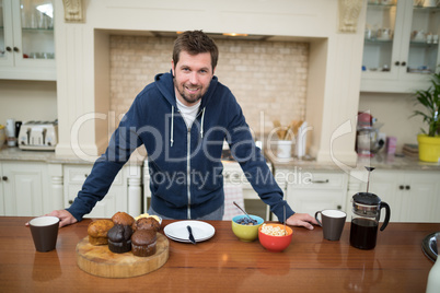 Man preparing muffins in the kitchen